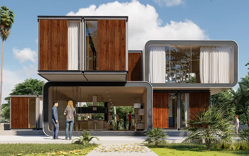 Modern modular container home with wooden accents and large glass windows surrounded by tropical trees.